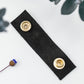 Thoughtfully crafted Black leather cable organizer with brass snap hardware, durable Keyaiira cord holder for headphones, USB cords, device chargers and clutter-free workspace storage
