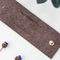Chocolate full-grain leather cord keeper with minimal brass hardware, artisan-made by Keyaiira for computer cables, charging wires, device cords and clutter-free electronics organization
