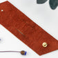 Cognac genuine leather cable management strap with Stud & Post hardware, handcrafted large cord keeper for computer cables, power cords, chargers and workspace organization by Keyaiira
