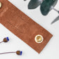 Cognac genuine leather cable management strap with double brass snaps, handmade reusable cord keeper for phone chargers, USB cables, computer cords and electronics organization by Keyaiira
