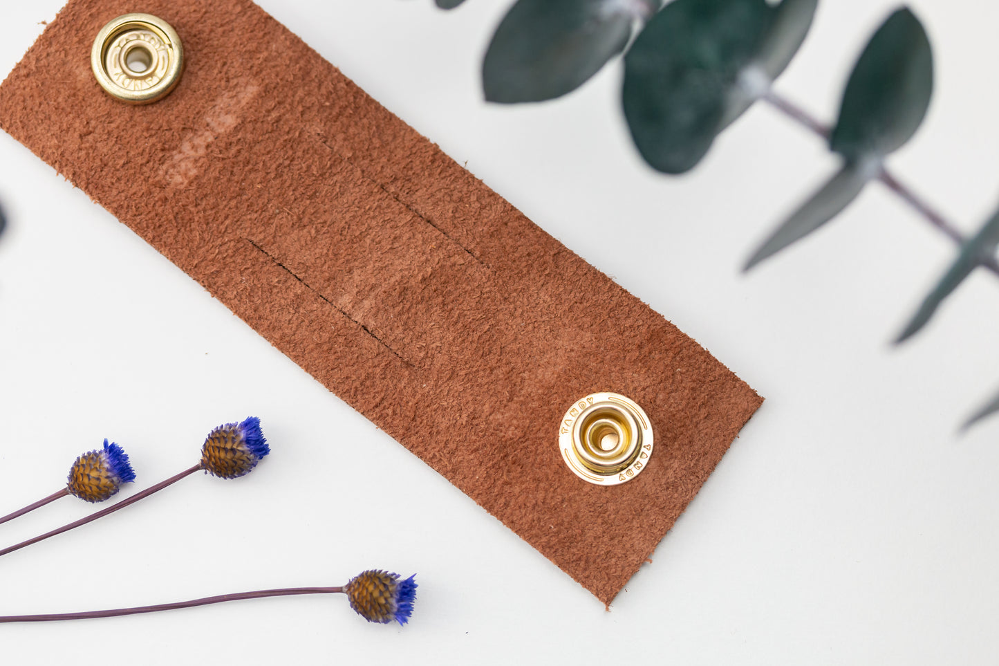 Cognac genuine leather cable management strap with double brass snaps, handmade reusable cord keeper for phone chargers, USB cables, computer cords and electronics organization by Keyaiira
