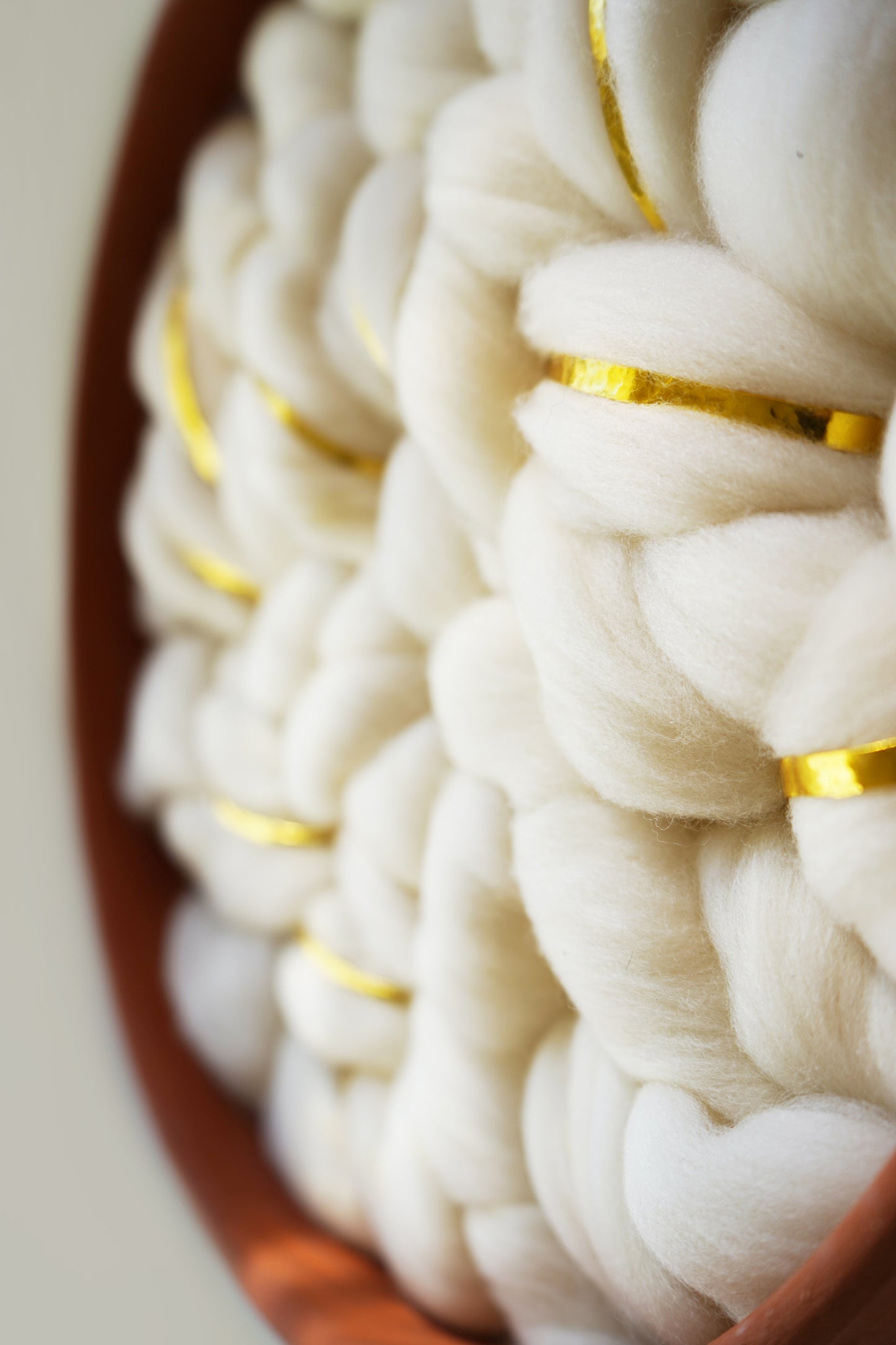 Macro view of sustainable fiber art materials. Detailed shot of cloud-like wool loops sourced from Cedarville, CA, demonstrating the high-relief texture and premium quality of the Fibershed Certified™ materials.