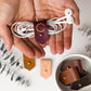 Wine full-grain leather earbud keeper with customized C initial, artisan-finished by Keyaiira for wired headphones, charging cords, small electronics and tangle-free travel storage

