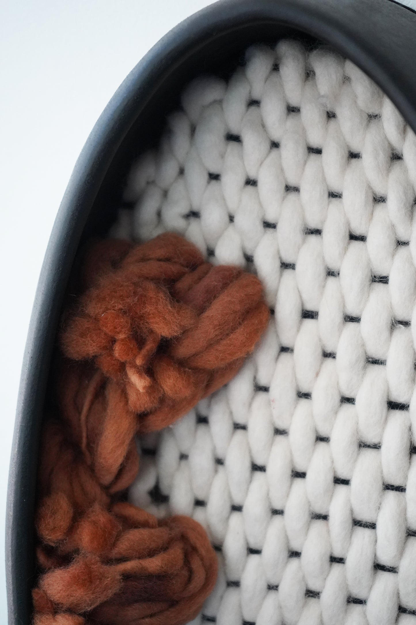 Wabi-sabi inspired woven wall hanging. A textural statement piece mixing hard ceramic and soft wool. Ideal for Japandi, mid-century modern, or earth-tone living room decor.